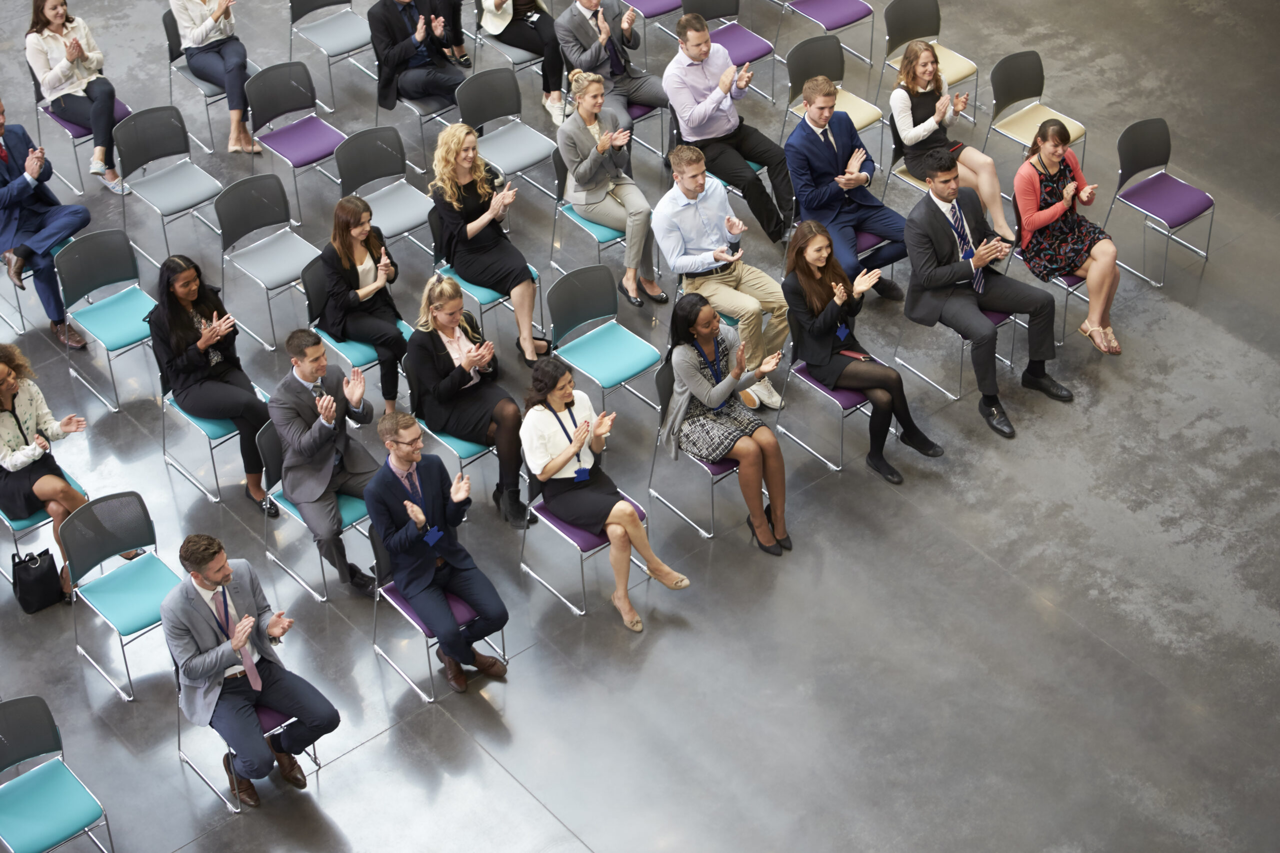 overhead view of audience applauding speaker at co 2024 10 19 14 13 30 utc scaled